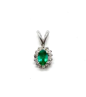 Emerald with diamond halo pendant Emerald with diamond halo pendant