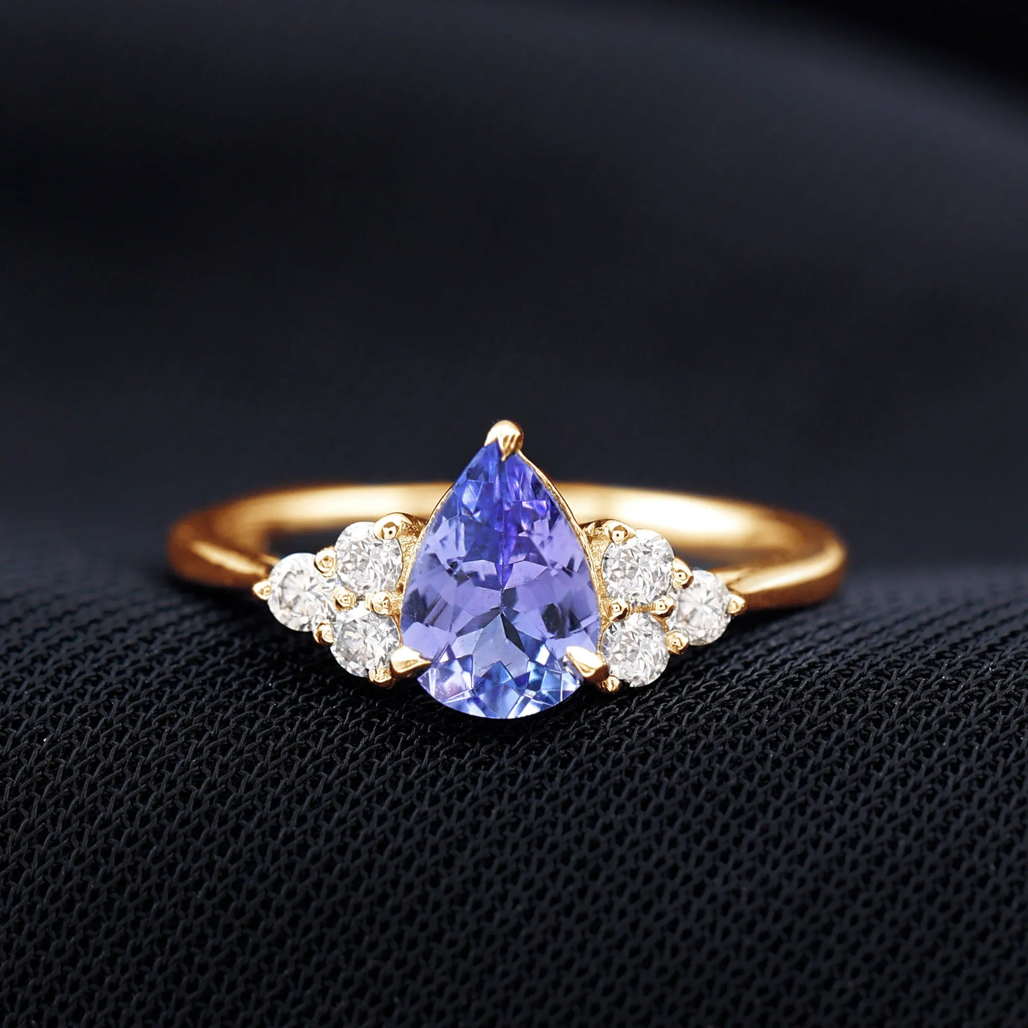 Pear Shaped Tanzanite Solitaire Ring with Diamond Trio