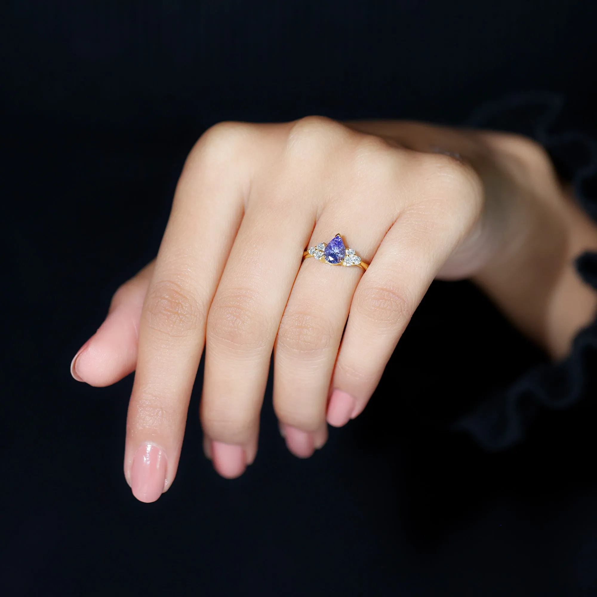 Pear Shaped Tanzanite Solitaire Ring with Diamond Trio