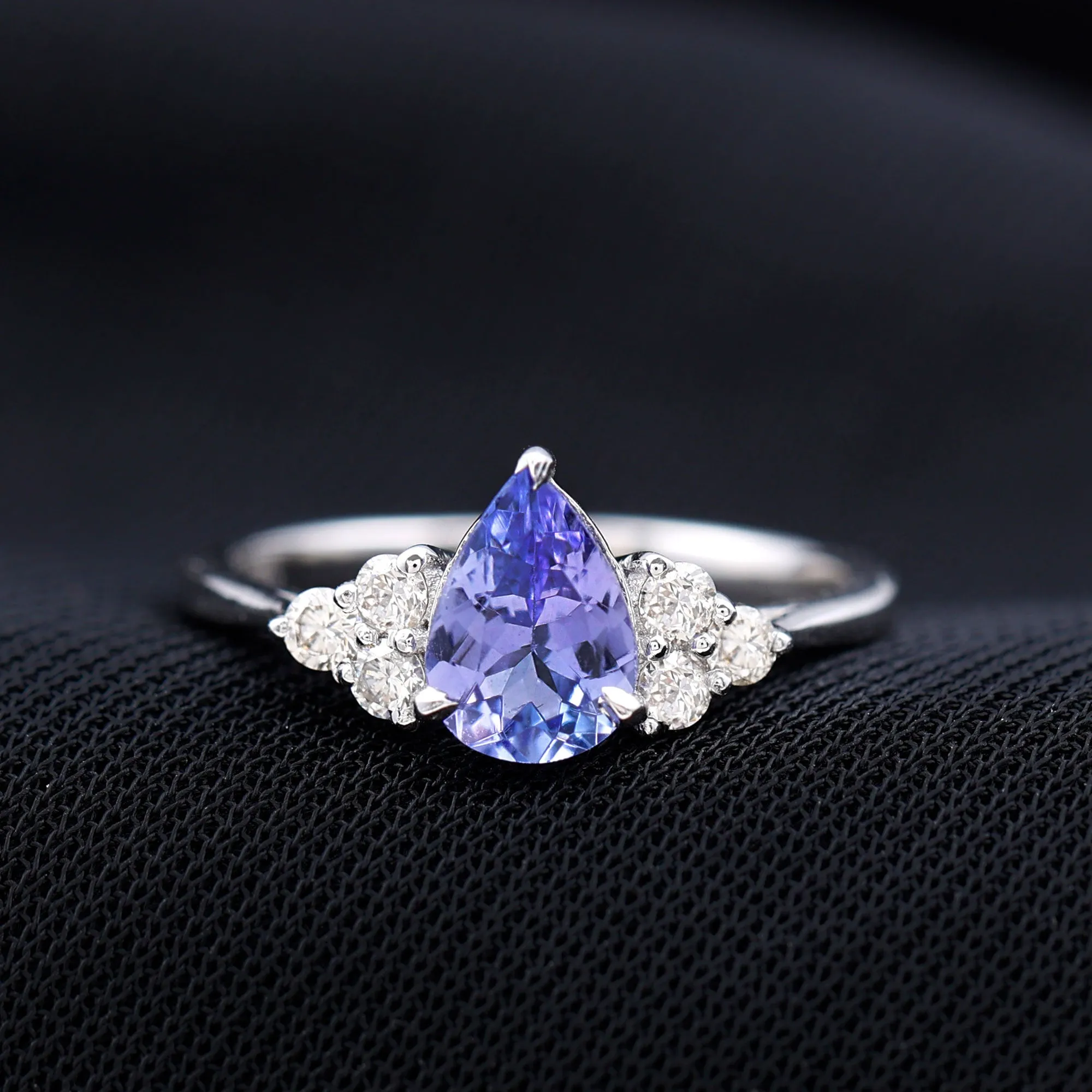 Pear Shaped Tanzanite Solitaire Ring with Diamond Trio