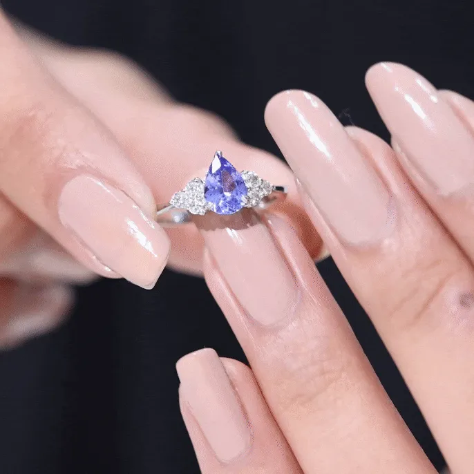 Pear Shaped Tanzanite Solitaire Ring with Diamond Trio