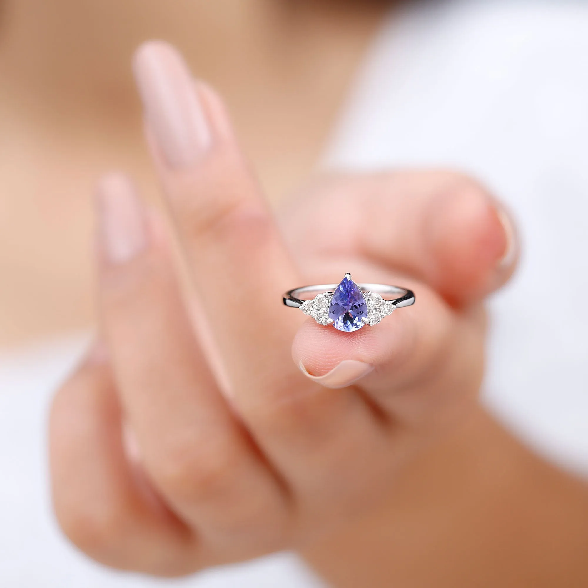 Pear Shaped Tanzanite Solitaire Ring with Diamond Trio