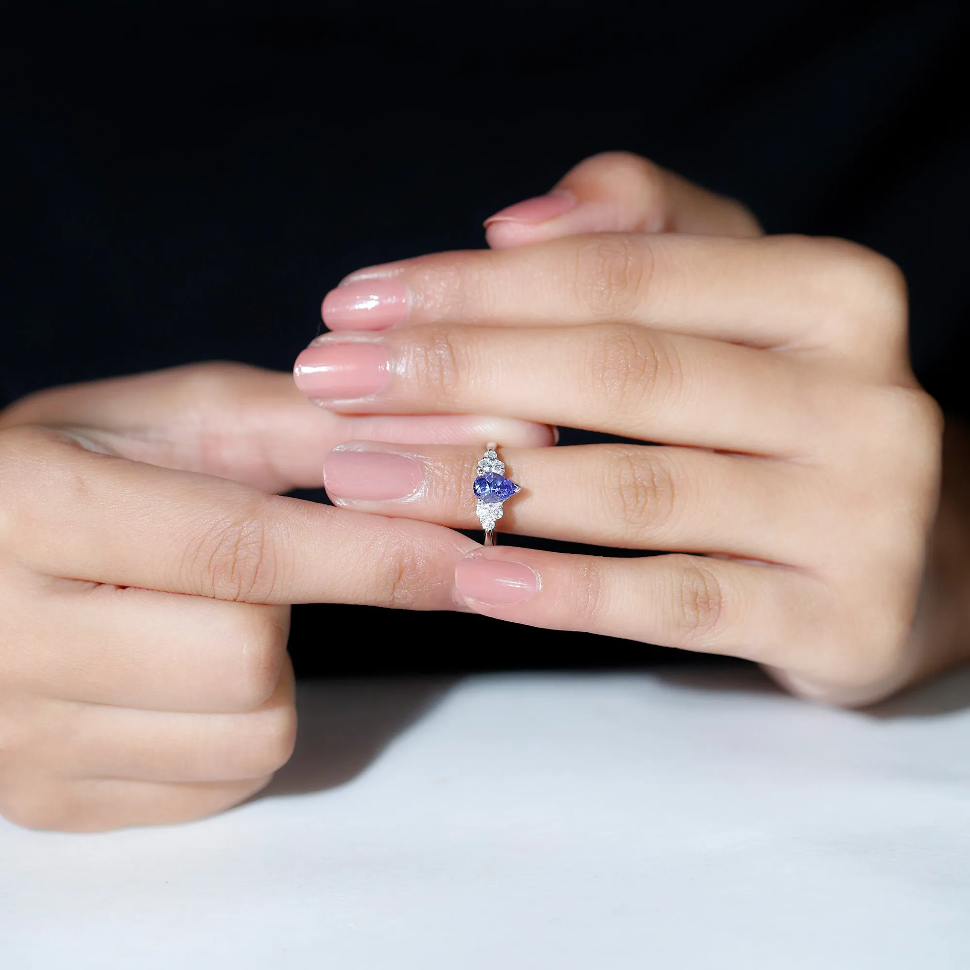 Pear Shaped Tanzanite Solitaire Ring with Diamond Trio